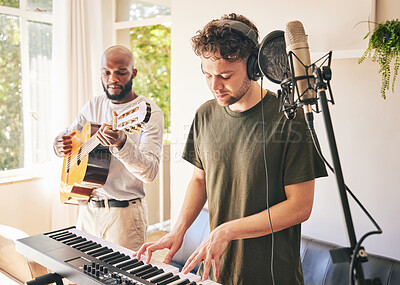 Buy stock photo Piano, recording music and friends with guitar in home studio together. Electric keyboard, instrument and microphone of singer in collaboration for acoustic production with headphones of creative men