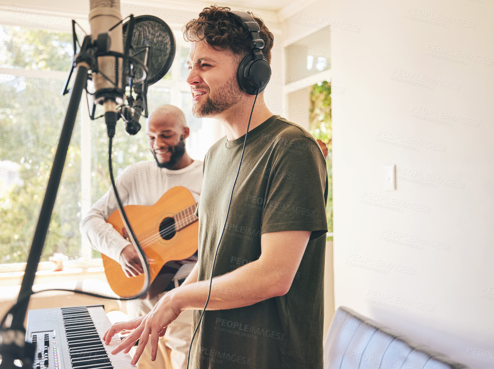 Buy stock photo Microphone, guitar and friends singing with piano in home studio together. Electric keyboard, acoustic instrument and recording band, creative music production and men live streaming on headphones.