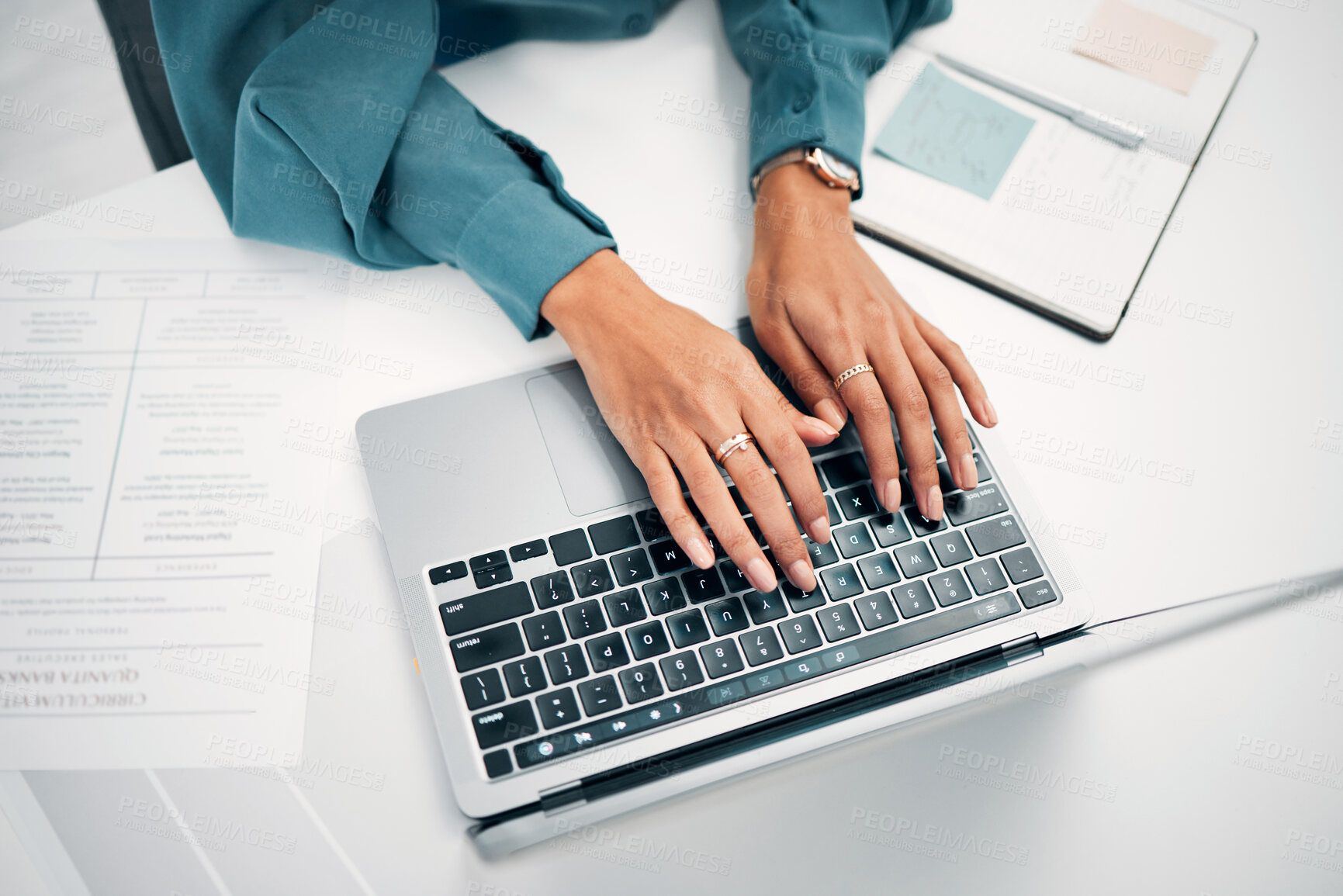 Buy stock photo Above, business and hands with typing on laptop, desk and office for career in human resources. Woman, corporate worker and writing on keyboard with pc, technology and internet on cv for job search