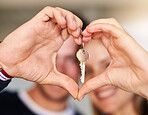 Portrait, couple and keys for new home, heart hands and real estate with love, support and trust. Closeup, man and woman with care emoji, lock for security and symbol for kindness, house and mortgage