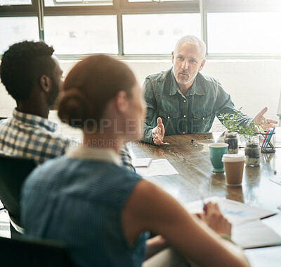 Buy stock photo Discussion, group and planning in meeting, office and collaboration for research or media strategist. Teamwork, creative and report of target market, documents and people in boardroom or conversation