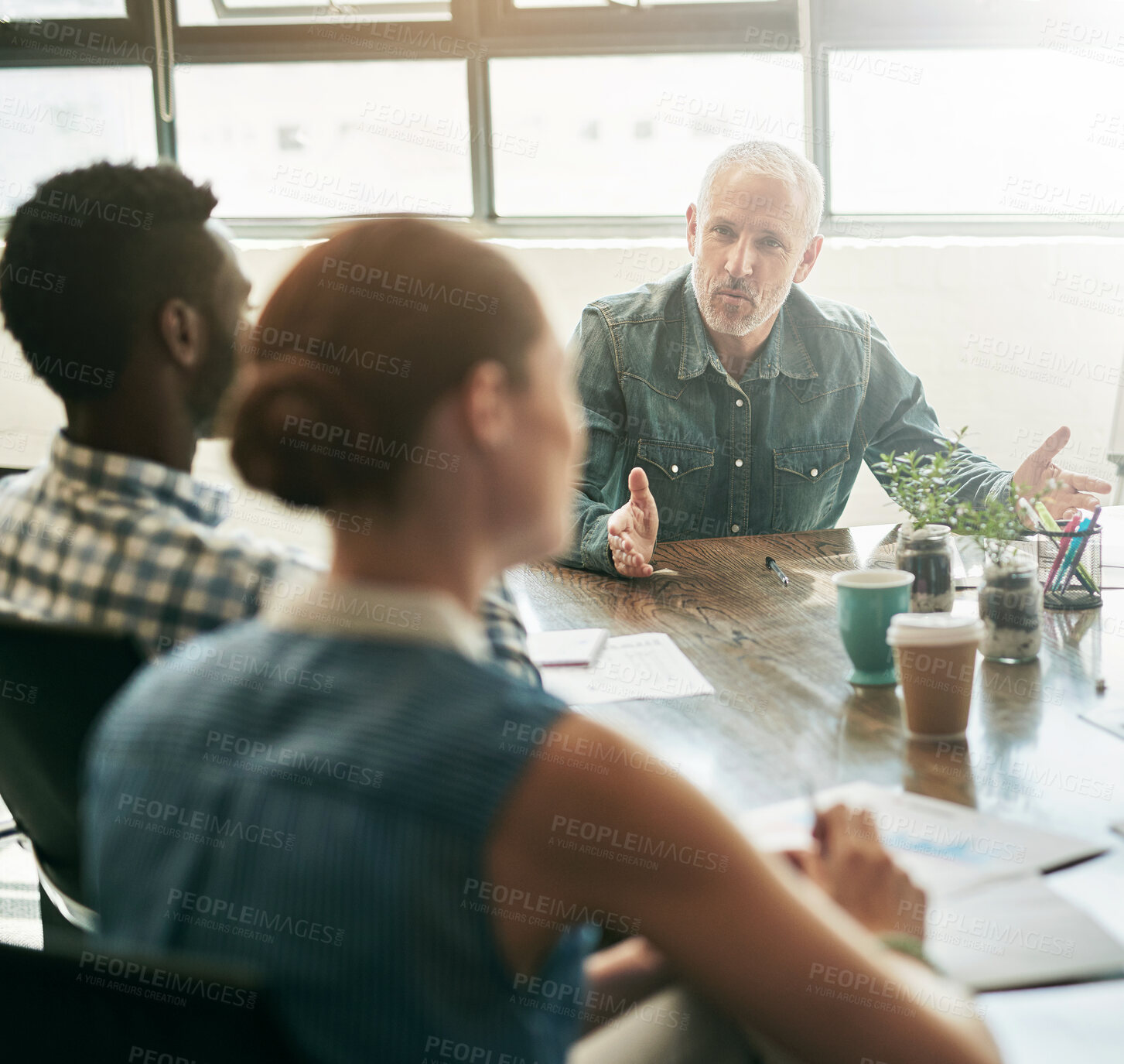 Buy stock photo Discussion, group and planning in meeting, office and collaboration for research or media strategist. Teamwork, creative and report of target market, documents and people in boardroom or conversation