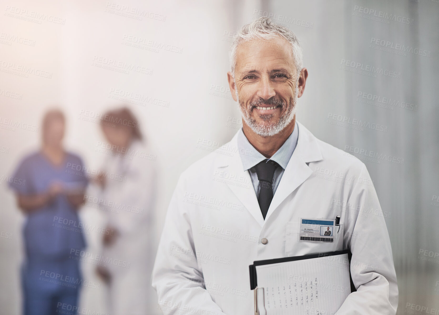 Buy stock photo Senior doctor, man and portrait with checklist, smile and pride for career in hallway at hospital. Mature medic, person and clipboard for info, notes or schedule with healthcare services for wellness