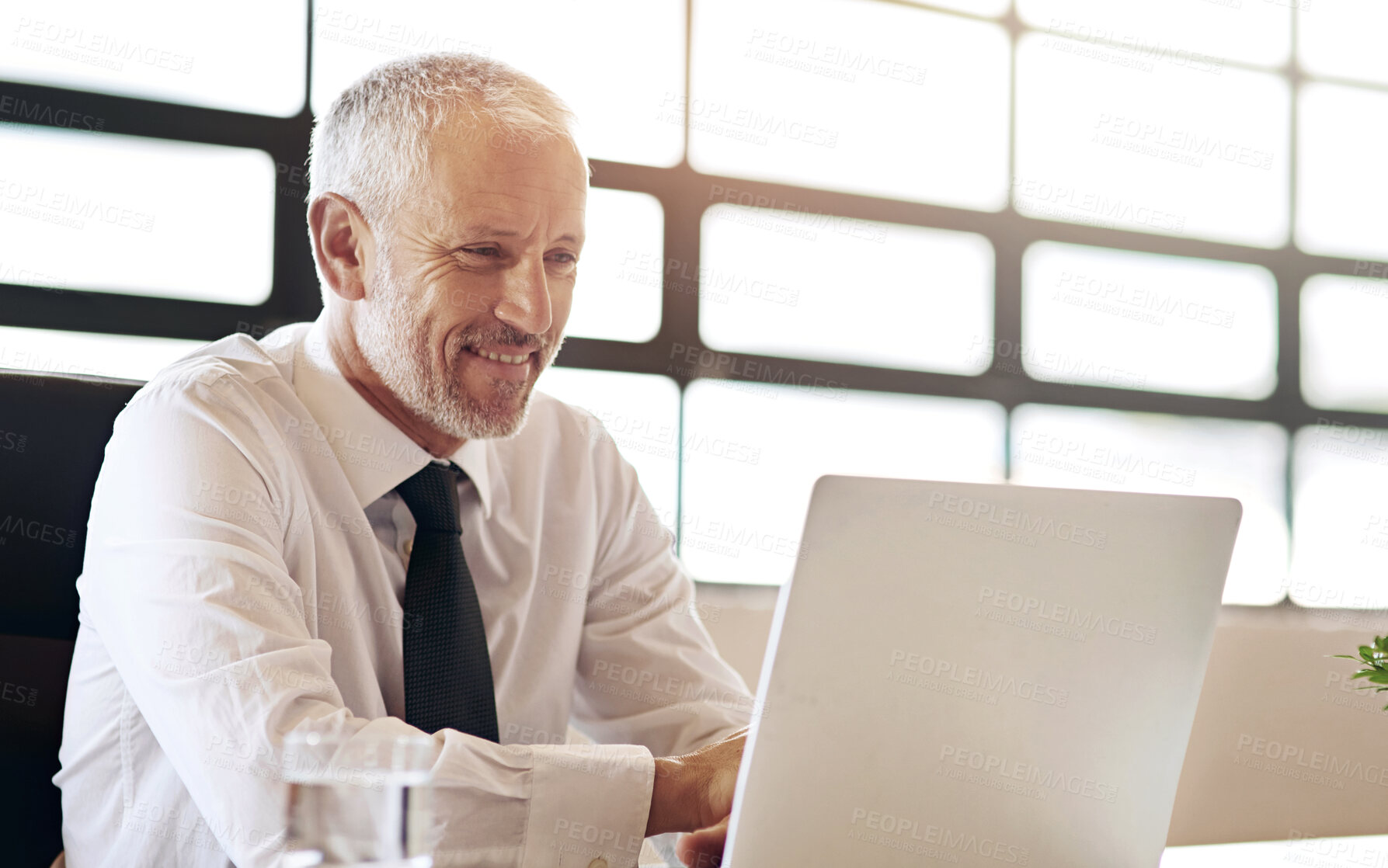 Buy stock photo Creative, man and portrait by window in office of designer agency for work as publicist for media or public relations. Male employee, confident and happy for reputation management for company.