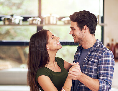 Buy stock photo Couple, happy and dancing in kitchen for bonding, romance and celebration with love for connection at house. Smile, woman and man with embrace for care, rhythm and memory for commitment of marriage