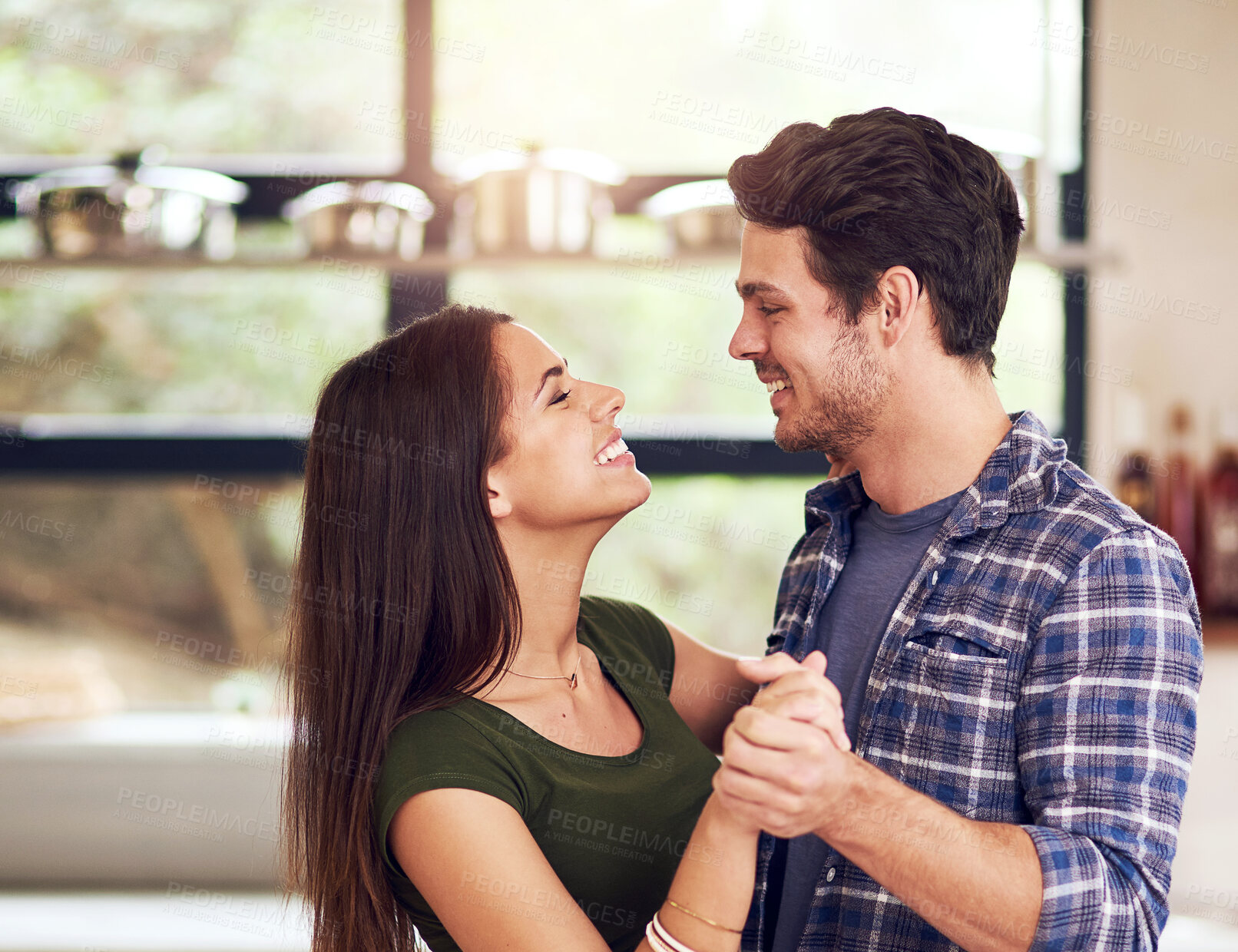 Buy stock photo Couple, happy and dancing in kitchen for bonding, romance and celebration with love for connection at house. Smile, woman and man with embrace for care, rhythm and memory for commitment of marriage