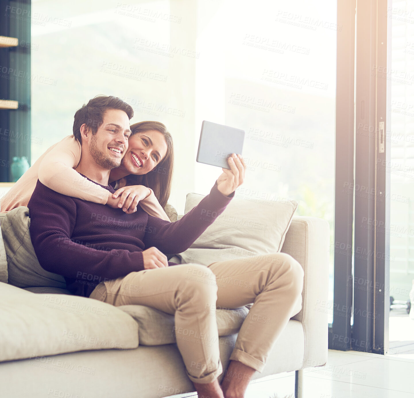 Buy stock photo Selfie, smile and tablet with couple on sofa in living room of home together for bonding or memory. Love, profile picture or technology with man and woman in apartment for social media update