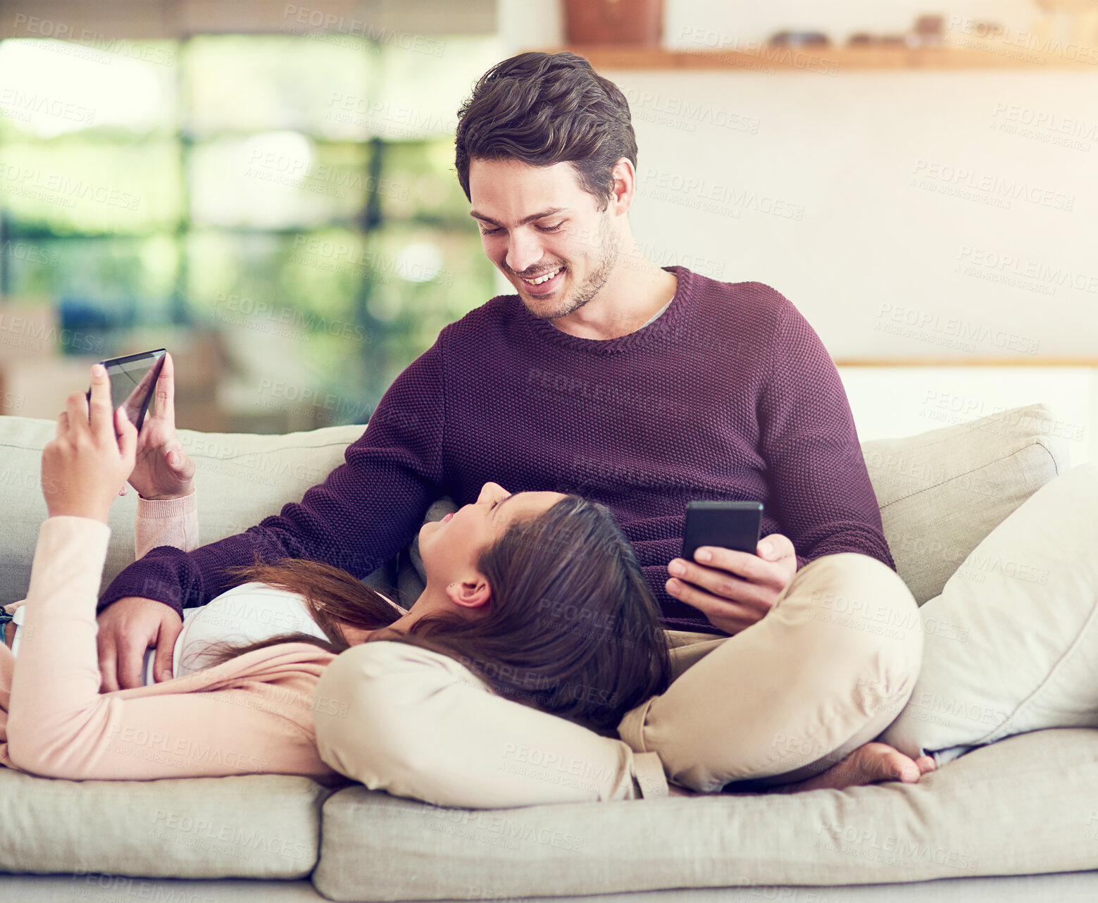 Buy stock photo Smile, couple and relax on sofa with technology for social media, movie or streaming video together. Tablet, man and woman in living room for online shopping or reading blog on mobile app in home