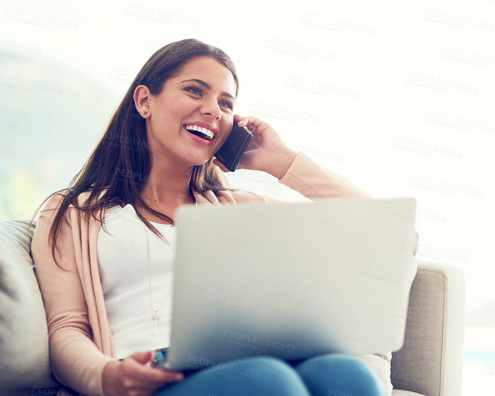 Buy stock photo Happy, phone call and woman on laptop on sofa for online networking, internet and remote work. Home, relax and person on smartphone for discussion, talking and conversation with computer for website