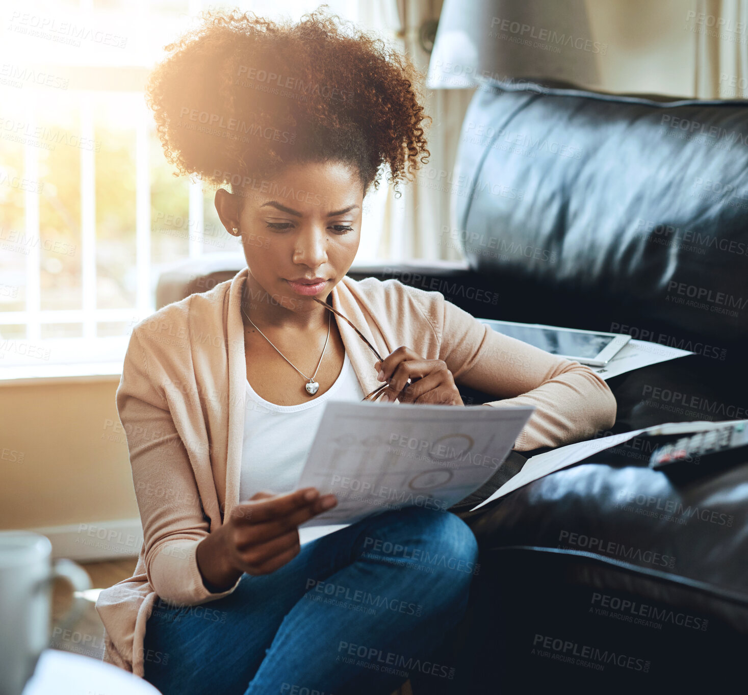Buy stock photo Banking, paperwork and black woman in home with bills, document and reading investment report. Wealth, savings or person plan future with student loan, info and budget for tax with finance strategy