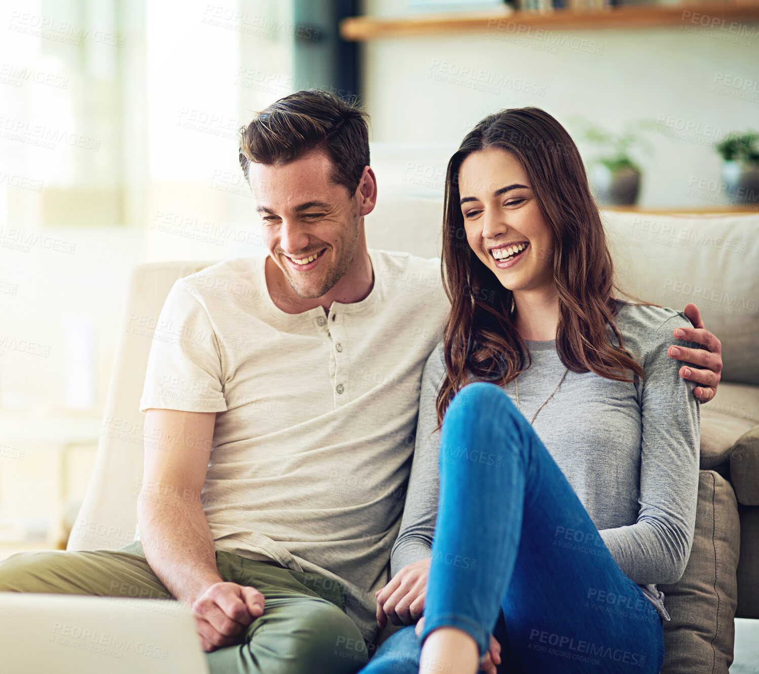 Buy stock photo Relax, smile and couple in living room with laptop for movies, streaming and online subscription on sofa. Computer, man and happy woman on floor in home watching comedy, video and embrace on weekend