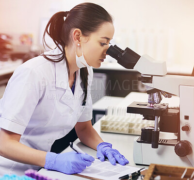 Buy stock photo Female scientist, analyse and microscope in laboratory for research or medical breakthrough. Health, data and notes with doctor or expert in microbiology with equipment for clinical trial in London.