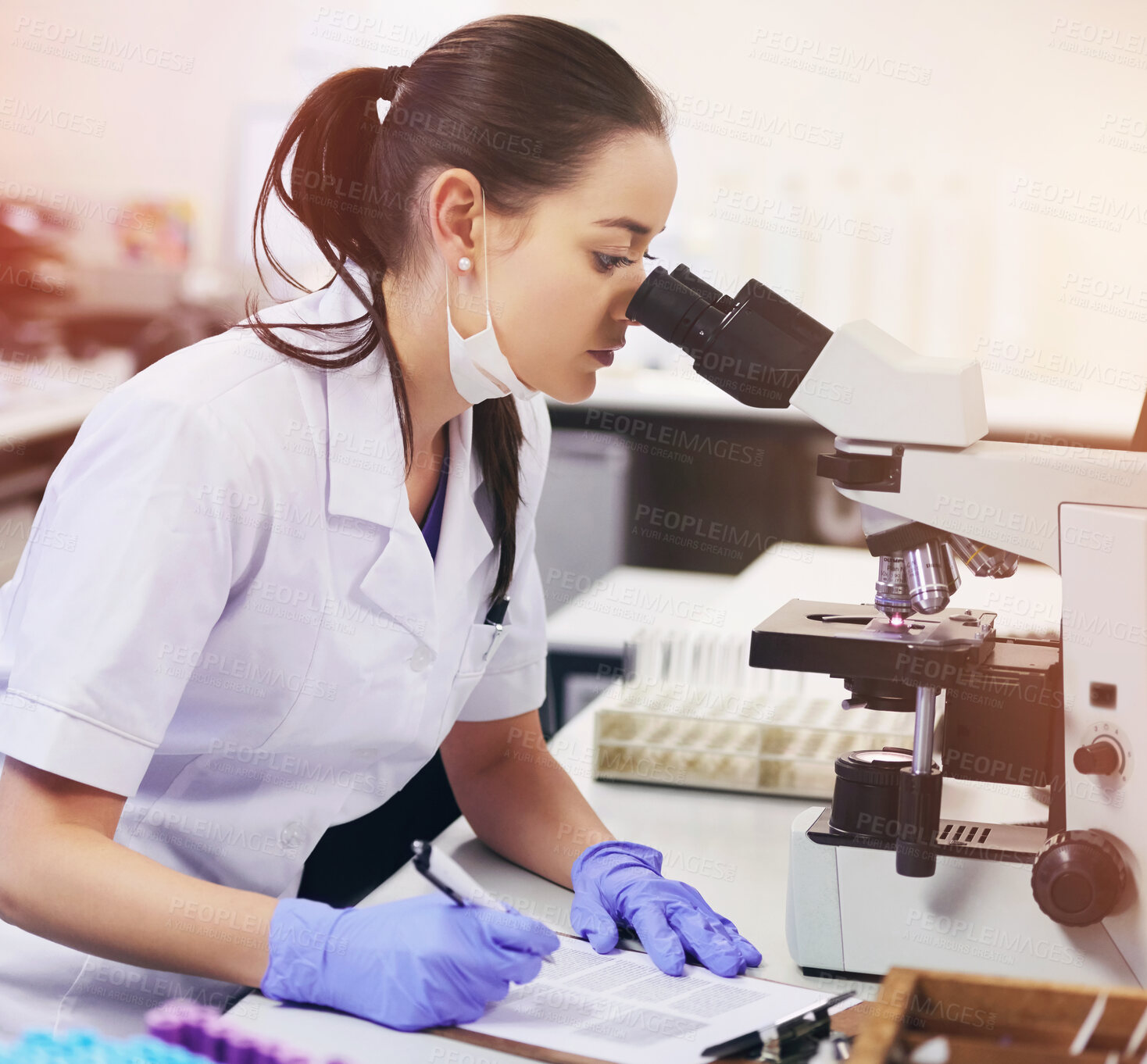 Buy stock photo Female scientist, analyse and microscope in laboratory for research or medical breakthrough. Health, data and notes with doctor or expert in microbiology with equipment for clinical trial in London.