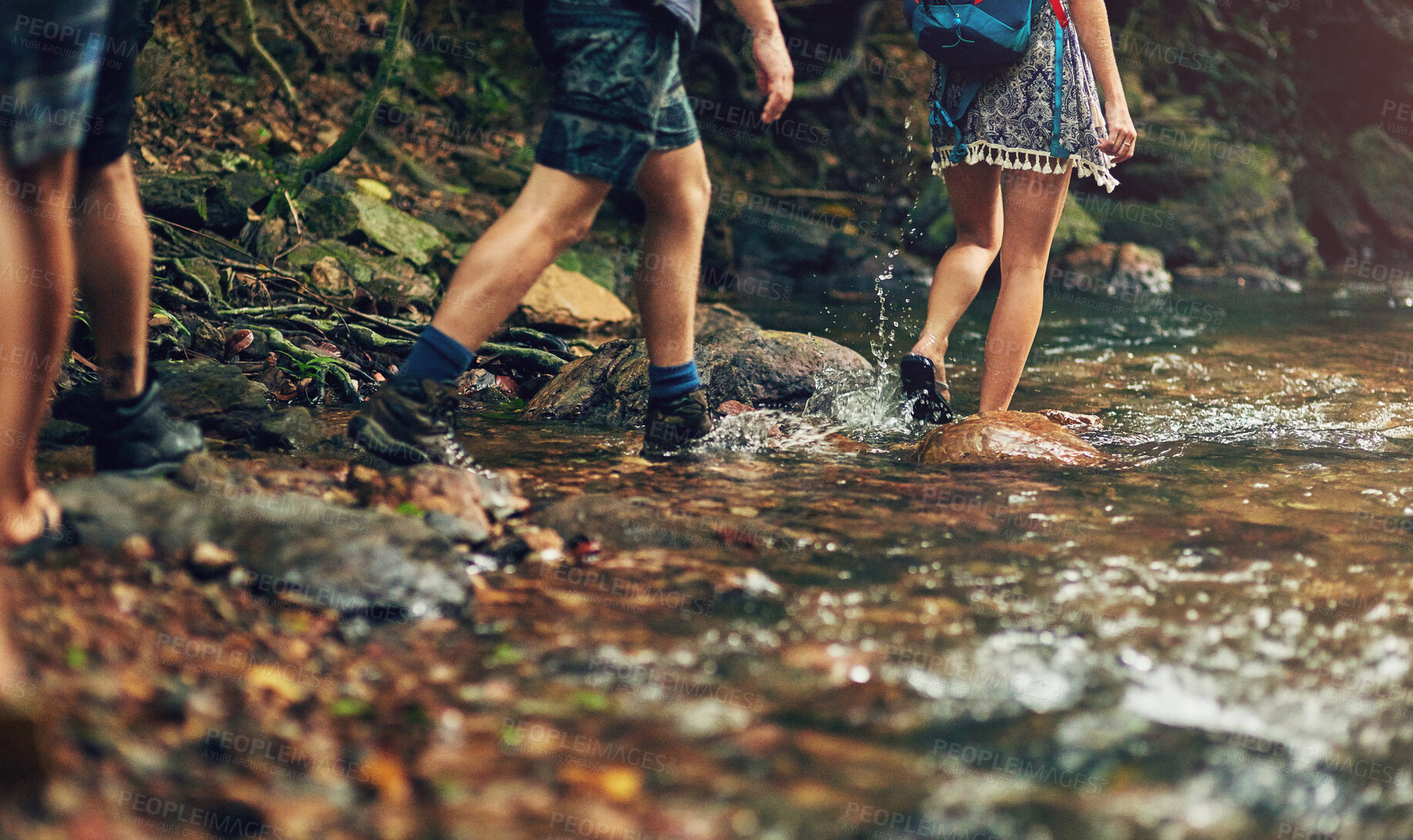 Buy stock photo People, legs and hiking with river in forest for journey or outdoor adventure in wilderness. Feet of group trekking in water for exploration, walking or travel in woods, nature or natural environment