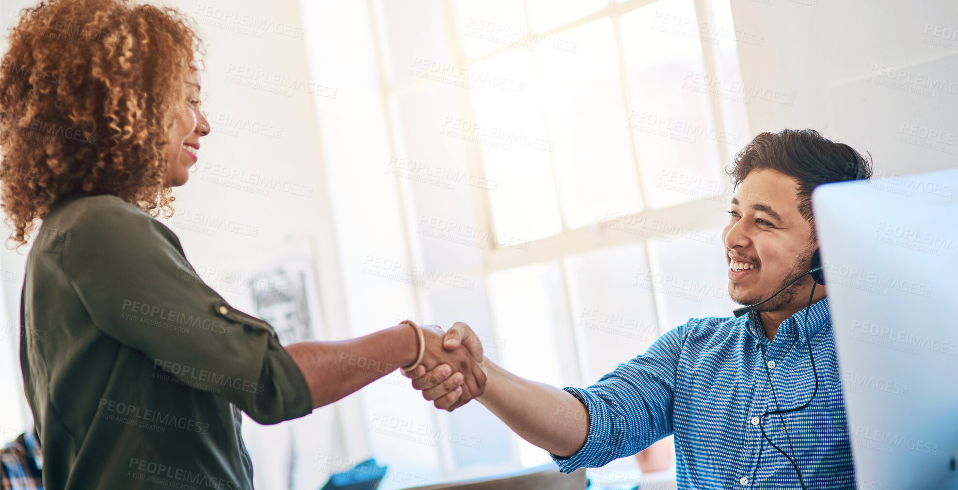 Buy stock photo Business people, man and woman with handshake, call center and telemarketing with promotion. Modern office, coworkers and employees shaking hands, computer and agreement with support and thank you