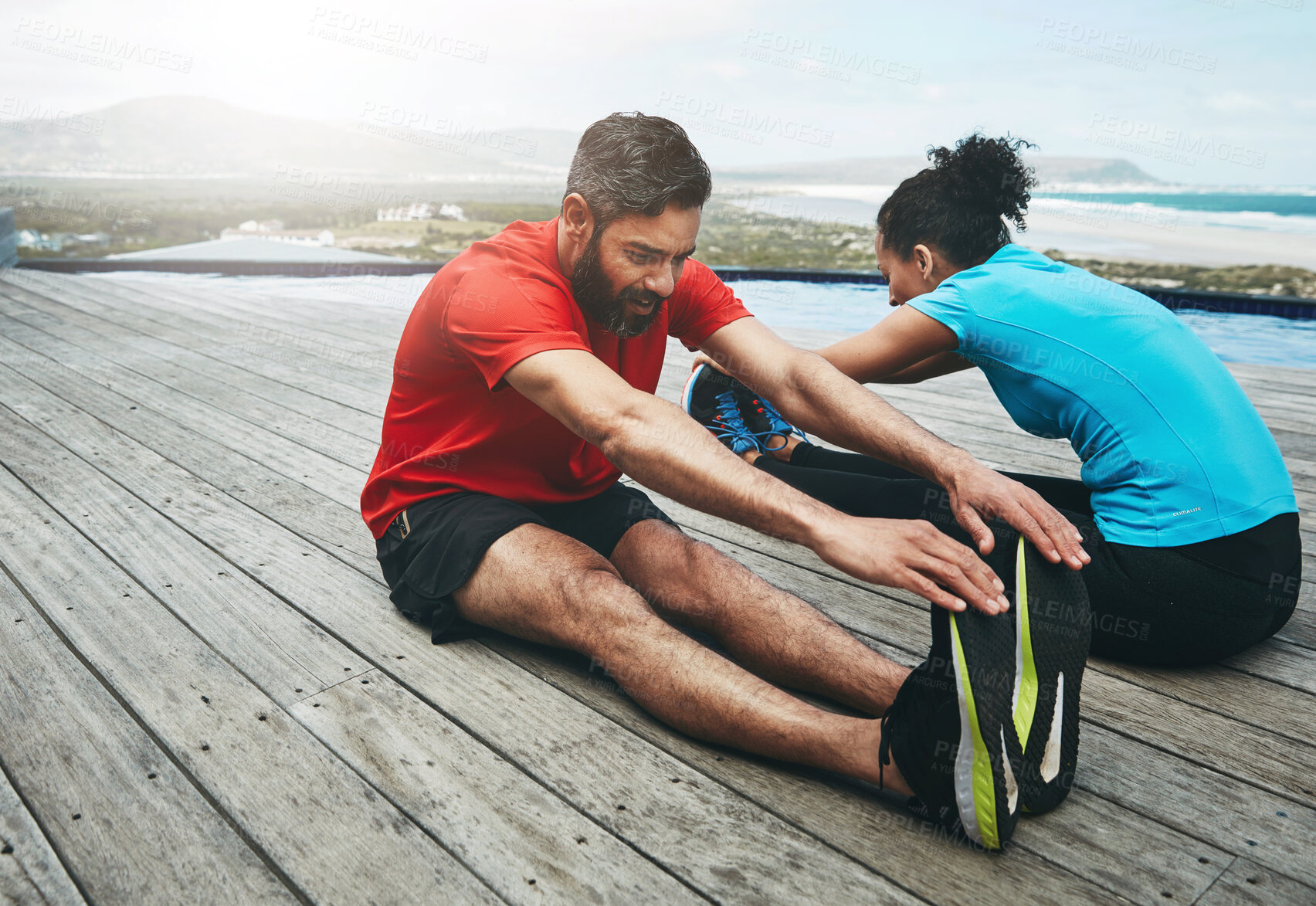 Buy stock photo Couple, stretching and legs for yoga in nature with warm up, workout or morning activity for flexibility on floor. People, exercise or teamwork for fitness by ocean with wellness, training and active