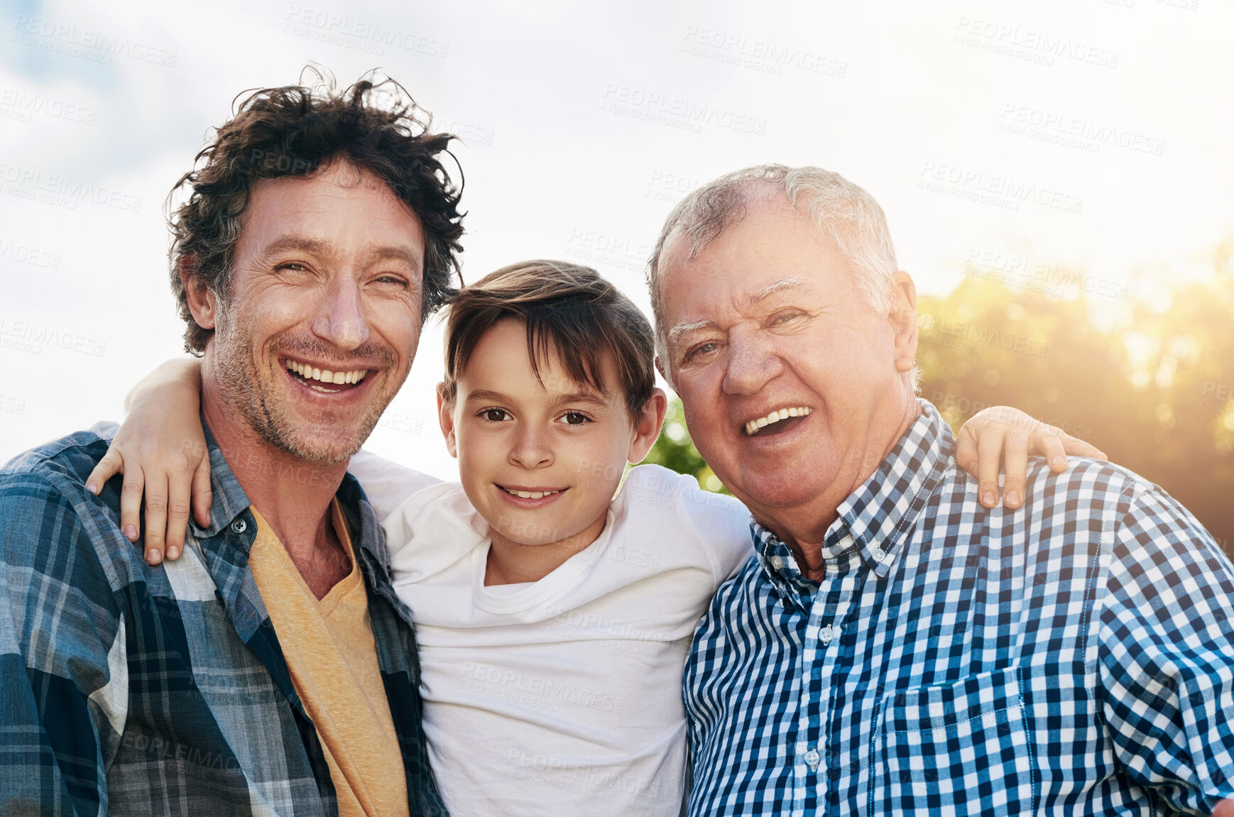 Buy stock photo Father, child and grandfather with portrait in outdoor park for happiness, support and bonding together. Lens flare, family and generations of men with smile for legacy, morning walk or weekend break