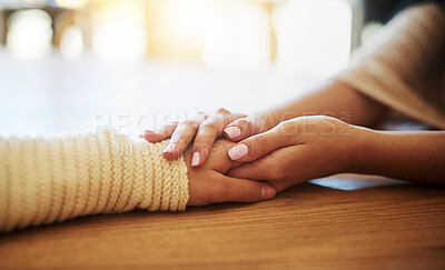 Buy stock photo Support, care and women holding hands on table for sympathy, comfort and compassion with grief. Unity, love and closeup of friends with trust, solidarity and prayer for hope and religion together.