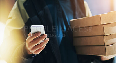 Buy stock photo Fast food, phone and hands of delivery man with pizza for distribution, online order and courier service in city. Package, ecommerce and person with boxes for lunch, dinner and supper on smartphone