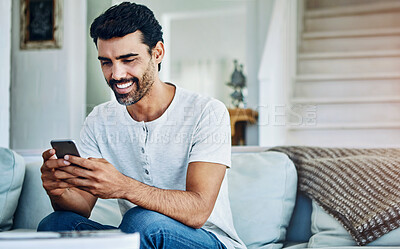 Buy stock photo Smile, phone and man typing on sofa for texting, communication or online notification in living room. Contact, connection and person with smartphone for social media, networking or web app in home