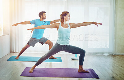 Buy stock photo Yoga, stretching and couple in living room for fitness, spiritual wellness and workout in home. Pilates, health and yogi woman with man for warrior pose exercise, balanced chi or healing body