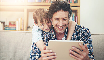 Buy stock photo Happy, tablet and father with child in home for watching movies, cartoons and online entertainment. Family, love and dad with son on digital tech for internet, video call and relax on weekend on sofa