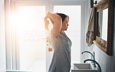 Buy stock photo Beauty, mirror and girl with hair check in bathroom for morning, start and routine in her home. Hairstyle, profile and woman in house with haircare reflection for ponytail, cosmetics or getting ready