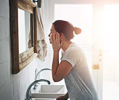 Buy stock photo Home, bathroom and woman with mirror, morning and skincare with anti aging, wellness and beauty. Apartment, person and girl with reflection, makeup and cosmetics with grooming routine and treatment