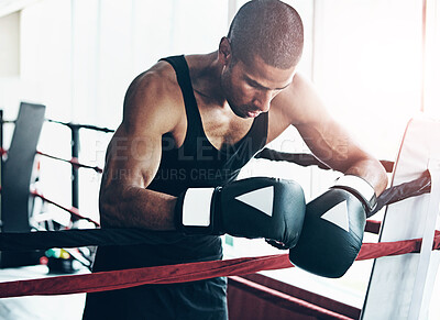 Buy stock photo Tired, boxer and man in ring at gym for challenge, exercise and fail competition in training for body health. Stress, fight and sport athlete resting on break with fatigue for fitness or depression