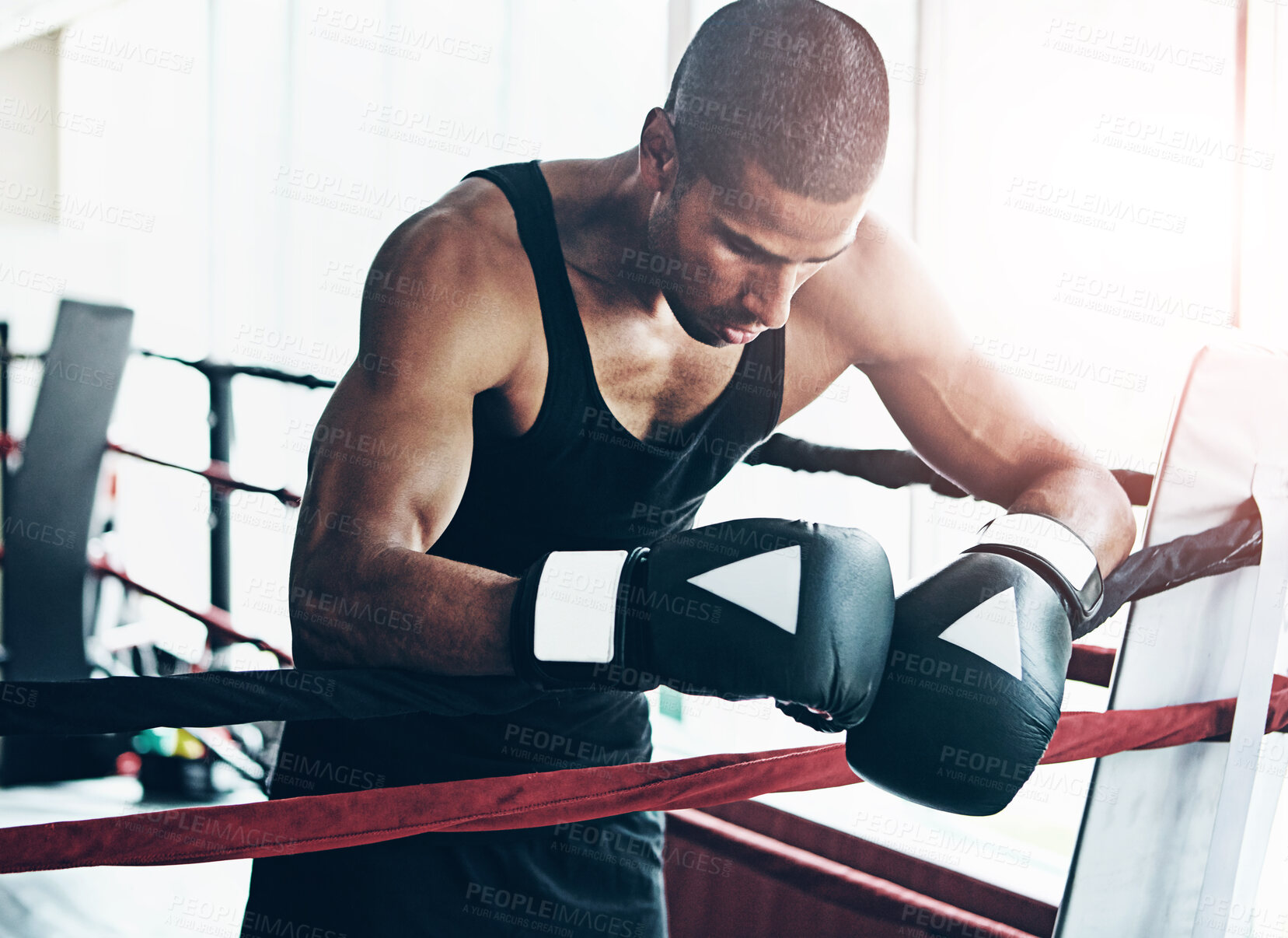 Buy stock photo Tired, boxer and man in ring at gym for challenge, exercise and fail competition in training for body health. Stress, fight and sport athlete resting on break with fatigue for fitness or depression