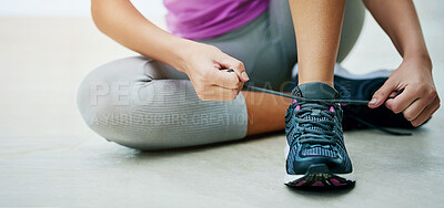 Buy stock photo Tie, shoes and hands of woman with exercise fashion or start of fitness routine on floor with feet. Workout, gear or runner prepare sneakers for training in gym with laces and closeup on footwear