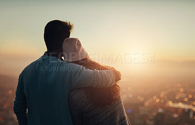 Buy stock photo Couple, back and hug for cityscape sunset, outdoor view and bonding for love in relationship. People, dusk and embrace for romance on holiday or vacation, travel and relax on mountain for scenery