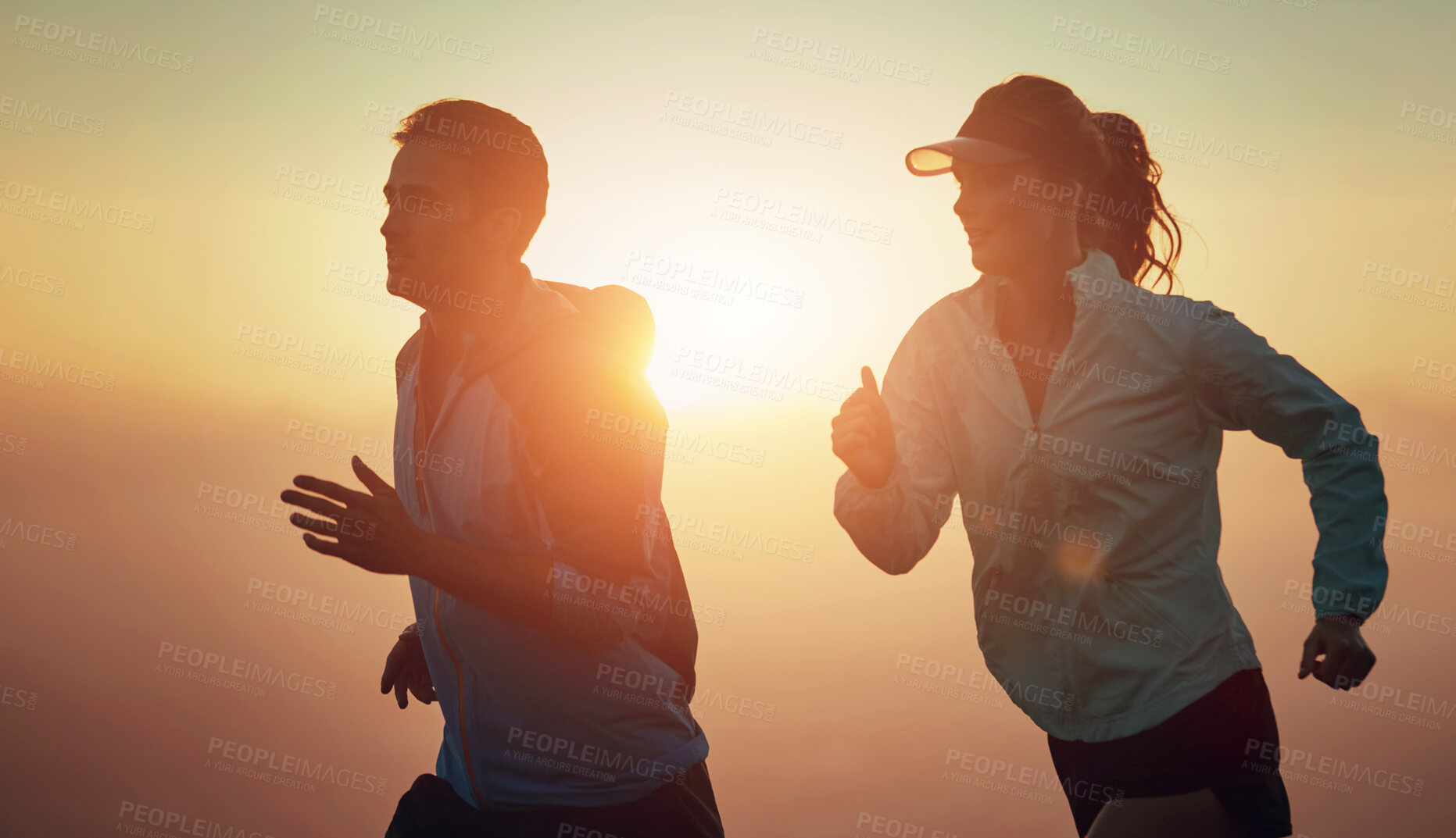 Buy stock photo Sunrise, couple and running outdoor for race training, exercise and fitness with cardio for health. Wellness, sport and athlete with runner partner in nature together in the morning with sprint