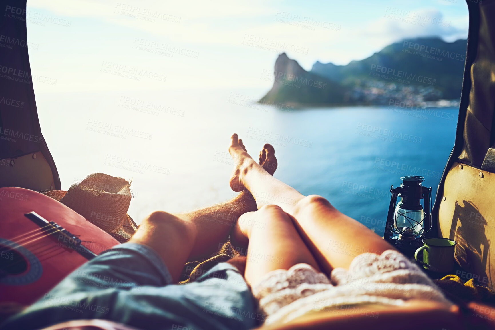 Buy stock photo Couple, legs and van from view with road trip in Cape Town, beach vacation with relax in summer. People, transport and ocean with mountain for freedom in nature, bonding on holiday for wellness