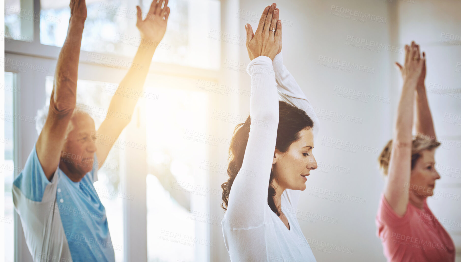 Buy stock photo Teacher, class and yoga with salute for wellness or Zen, peace and calm with lens flare in window. Group, diversity and people in lesson for health with mindset, breathing and stretching with hands