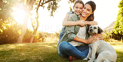 Buy stock photo Mother, daughter and playing with dog in park for bonding, relax and happy with fun activity in nature. Family, woman and girl child with puppy on grass in environment with sunlight, mockup and smile