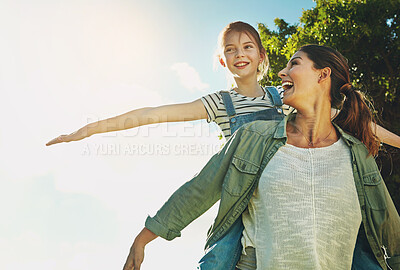 Buy stock photo Mother, playing airplane and girl with blue sky in outdoor park for game, fun and bonding together. Nature, happy mom and young daughter for flying arms, summer vacation or weekend in Arizona