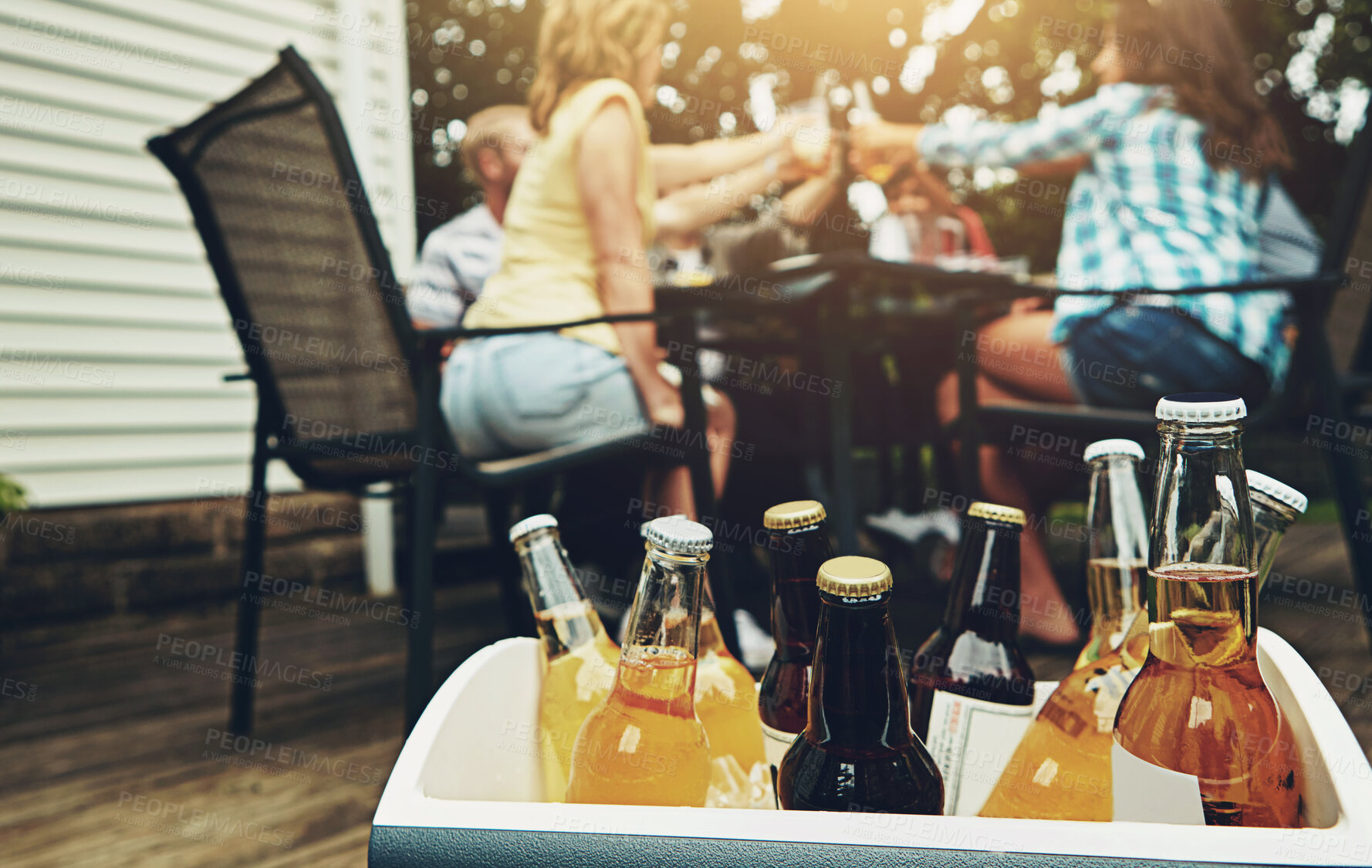 Buy stock photo Group, people and drinks at barbecue in backyard, summer and vacation for holiday, celebration or event. Friends, cheerful and bbq with cooler box for dinner, party or reunion with alcohol in America