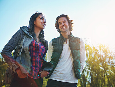 Buy stock photo Happy, young couple in park or nature together for holiday, vacation and romantic weekend break. Smiling, man and woman relax in forest or green environment for peace, love and summer travel 