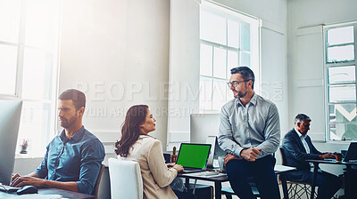 Buy stock photo Teamwork, laptop green screen and business people in office talking, discussion or conversation. Collaboration, mock up and employees, man and woman planning marketing, advertising or sales project.