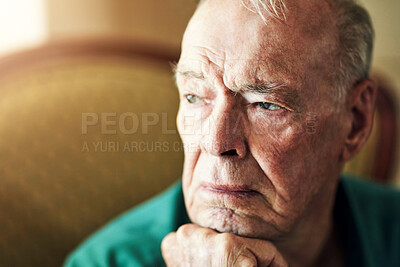 Buy stock photo Senior, man and lonely with thinking of memory in retirement home with remember, nostalgia or reflection on sofa. Elderly, person and sad with alzheimers, depression and thoughtful on couch in lounge