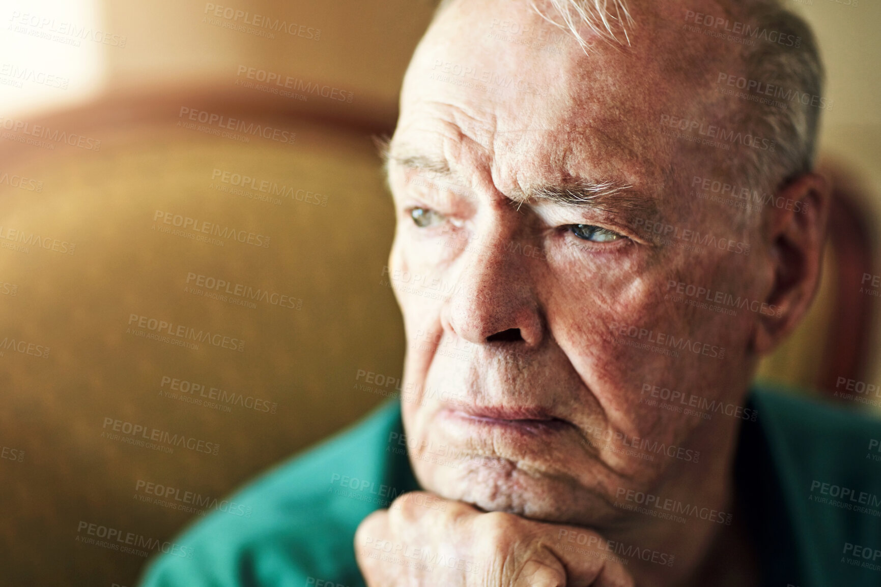 Buy stock photo Senior, man and lonely with thinking of memory in retirement home with remember, nostalgia or reflection on sofa. Elderly, person and sad with alzheimers, depression and thoughtful on couch in lounge