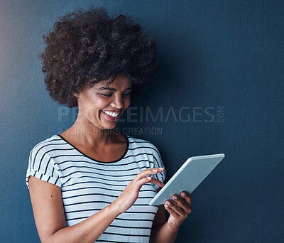 Buy stock photo African student, girl and tablet in studio for reading, thinking or study on app for test by blue background. Person, woman and click on digital touchscreen, online course or elearning for education