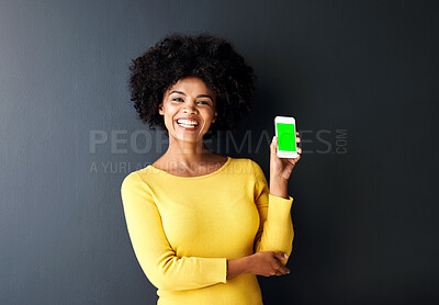 Buy stock photo Happy, black woman and green screen on smartphone in portrait on studio background with chromakey. Cheerful, female person and tech in studio with mockup space in streaming, movie for entertainment
