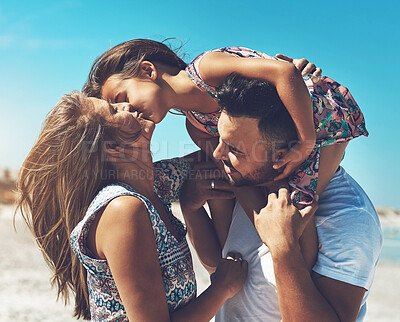 Buy stock photo Family, parents and girl child on beach kiss with love for holiday, vacation and development together on trip. Happy, man and woman on seashore with kid for bonding, adventure and explore bali water