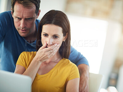 Buy stock photo Couple, laptop and shock with stress in home, reading and cover mouth for debt, credit score or lost investment. Woman, man and surprise with computer for news, update or story for financial crisis