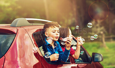 Buy stock photo Blowing, bubbles and children for fun by window in nature, outdoor or countryside with soap toys. Kids, boy and girl in car for playing, freedom and childhood development of siblings with games