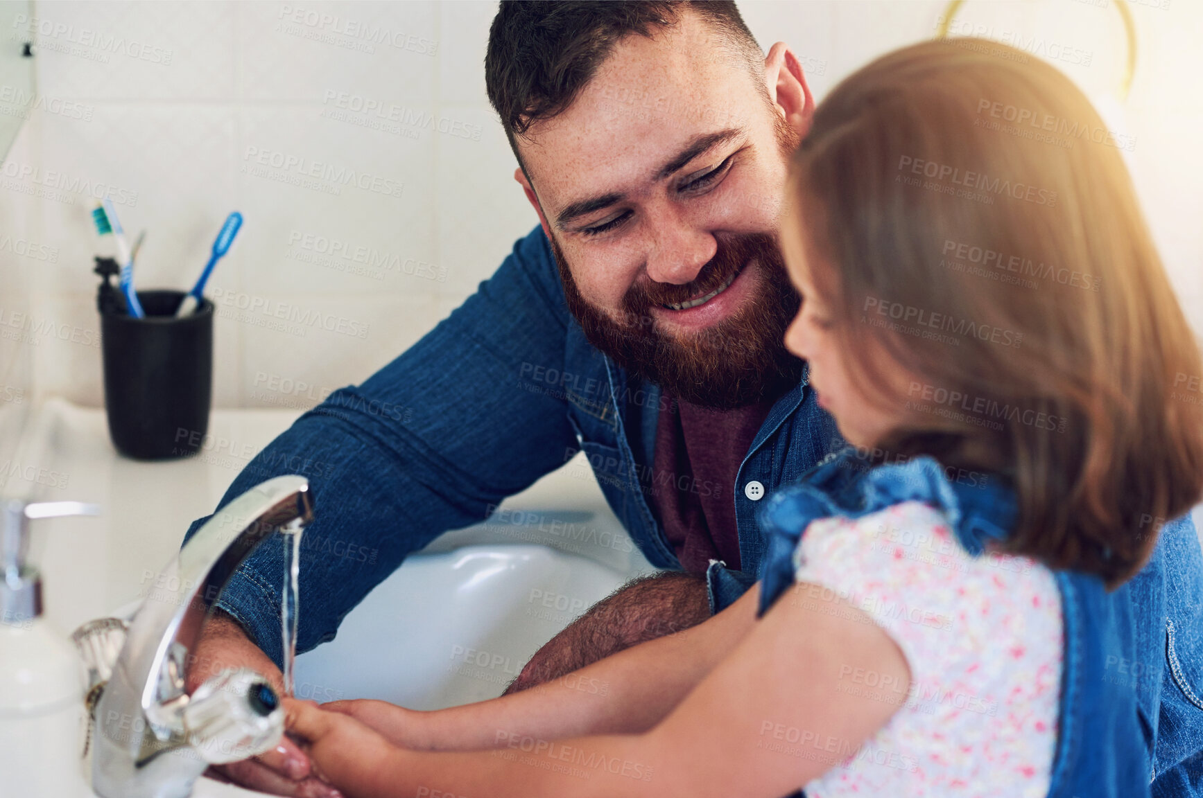 Buy stock photo Father, girl and wash hands with health for family hygiene in bathroom home, bonding and fun parenting. Happy, dad and child sanitise arms on water to get rid of bacteria, germs and dirt in a house