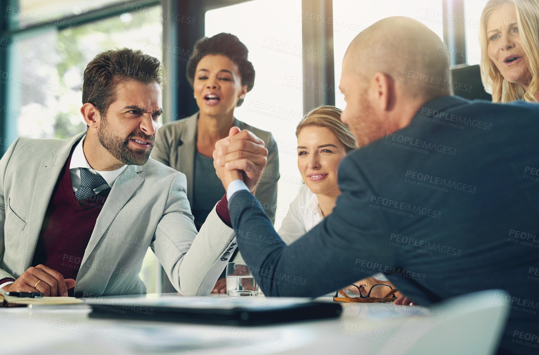 Buy stock photo Serious, businessmen and arm wrestle in office for corporate challenge and strength contest. Male employees, team building and meeting in boardroom for corporate competition, conflict or disagreement