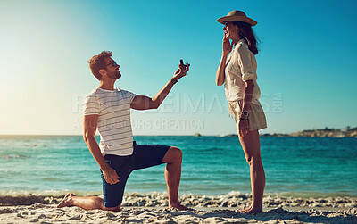 Buy stock photo Love, engagement and couple on a beach, sunshine and relationship with happiness, vacation and support. Surprise, man and woman on seaside holiday, proposal and ask for hand in marriage for romance